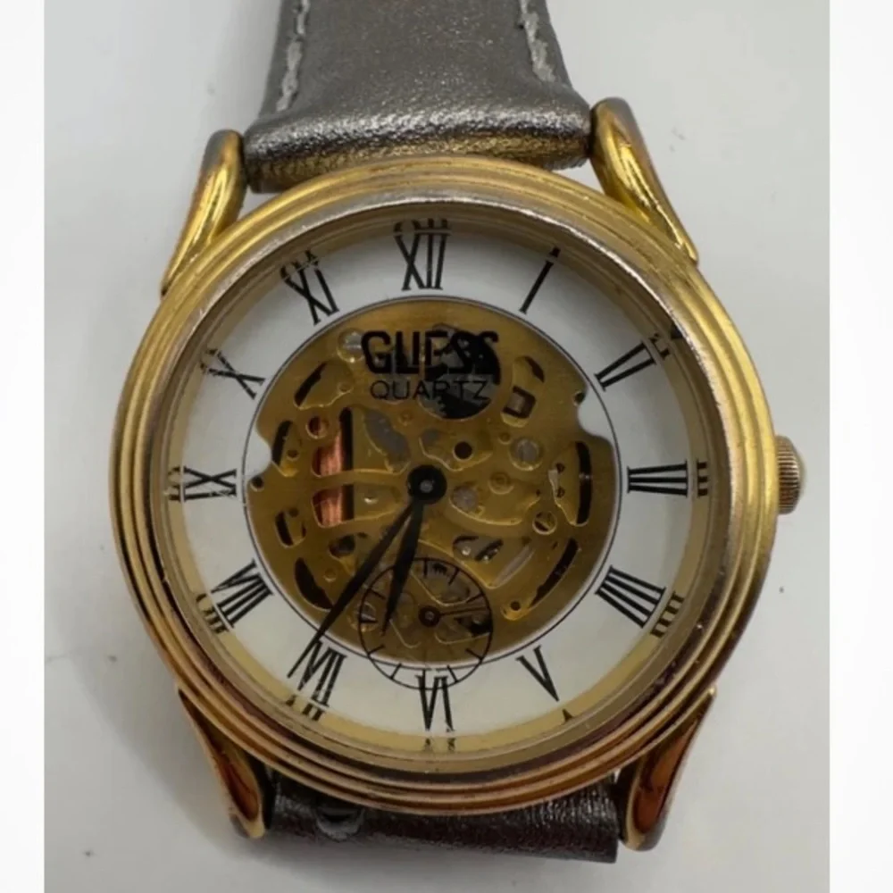 Guess Gold and Silver Quartz skeleton watch